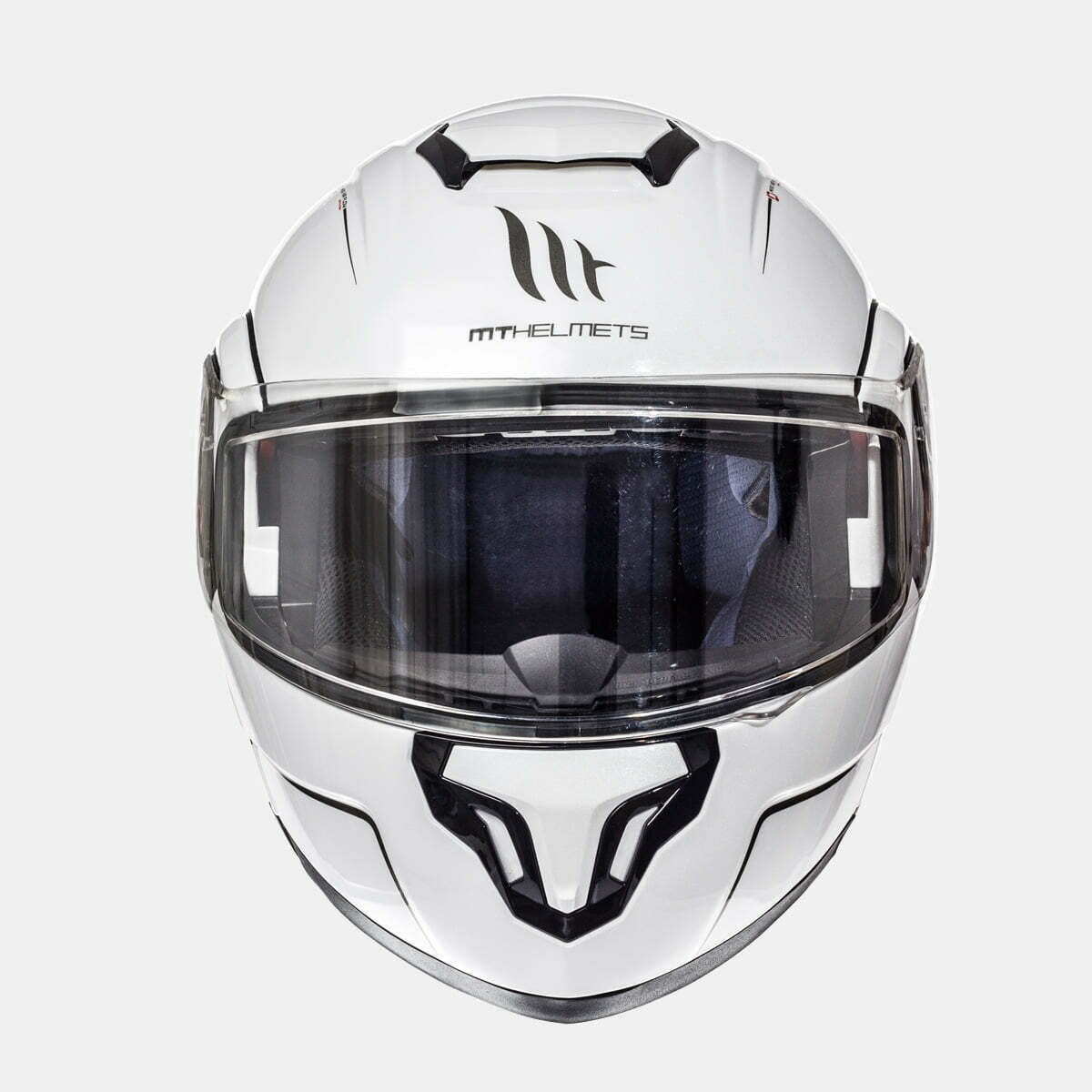 Framsidan av MT Helmets öppningsbar mc-hjälm Atom vit med klart visir och elegant design. Optimal för både komfort och säkerhet.