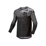 Alpinestars Crosströja Techstar Graphite i svart och grått med avancerad ventilation och slitstarkt material för motocrossåkning.